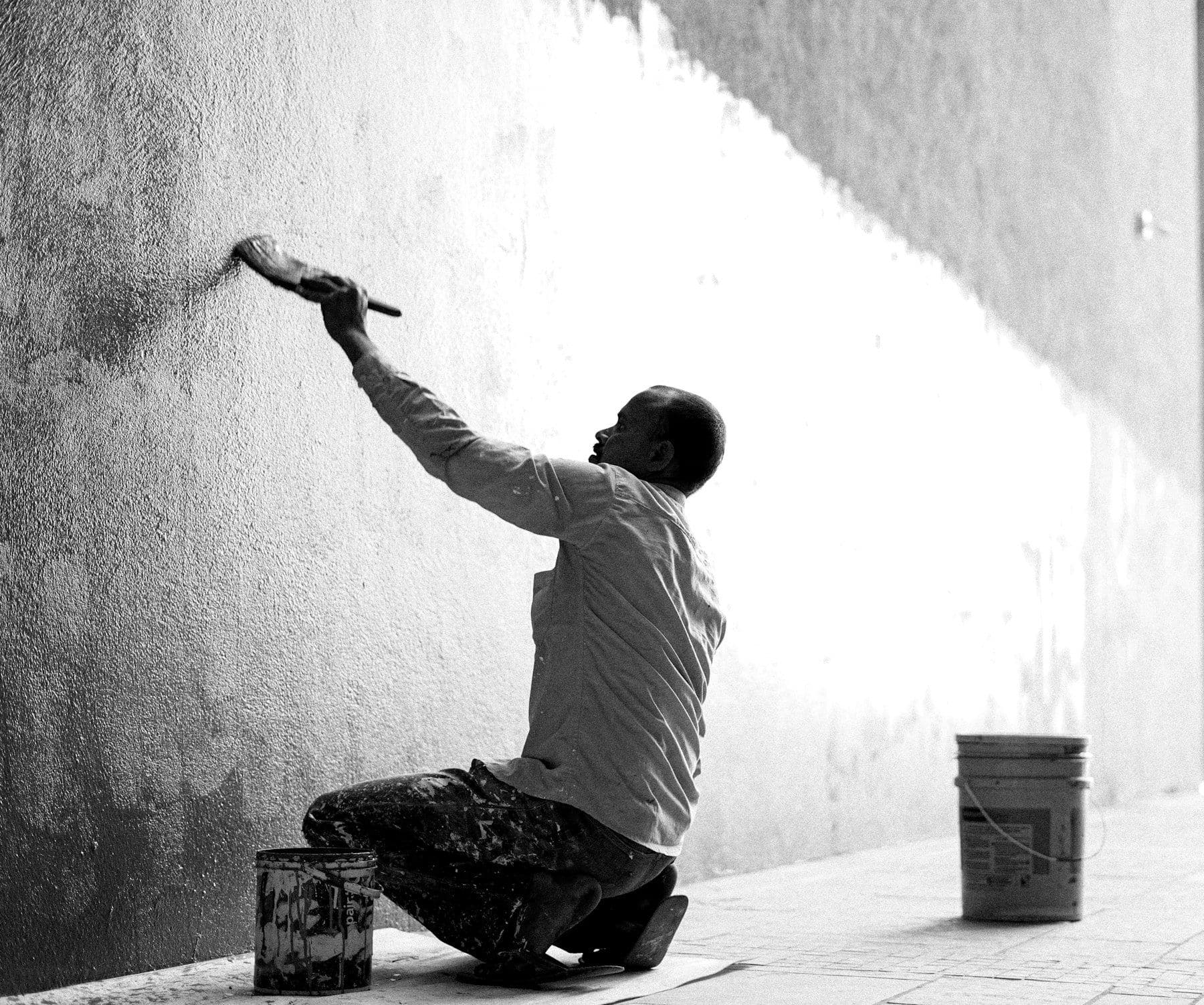 Pintunorte Painting LLC painter finishing a wall